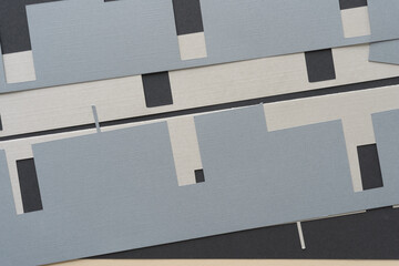 machine-cut geometric shapes layered on a relatively flat surface
