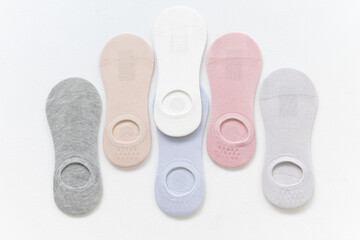 Short summer socks in pastel colors on a white background