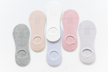 Obraz premium Short summer socks in pastel colors on a white background