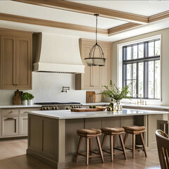 Fototapeta premium traditional kitchen with clean lines taupe painted base cabinets and island with wooden upper cabinets and a white plaster hood and light oak floors