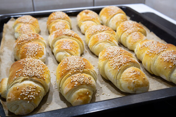 Homemade mini croissants on a sheet pan