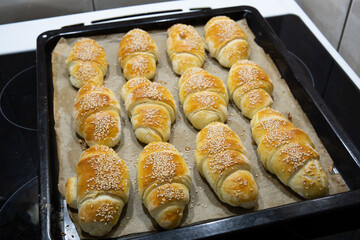 Homemade mini croissants on a sheet pan