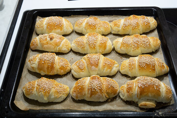 Homemade mini croissants on a sheet pan