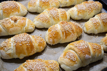 Homemade mini croissants on a sheet pan