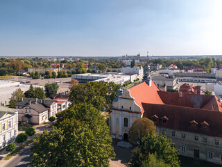 Obraz premium Summer skyline cityscape of Szamotuły, Wielkopolska, Poland. Wide panoramic aerial view