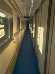 A sunny morning in the corridor of a passenger car, warm and still no one, a pleasant journey by...