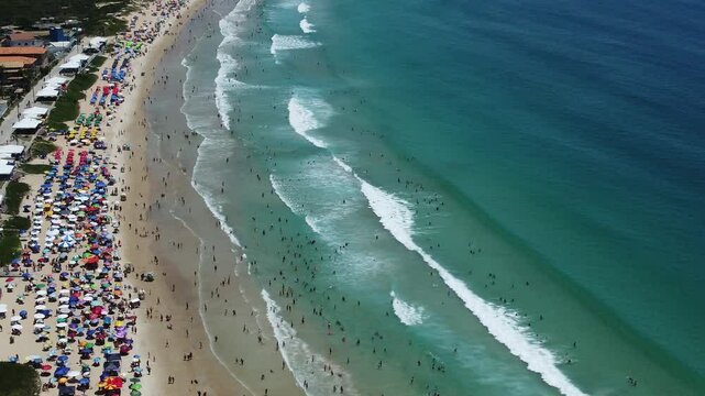 Aerial drone footage of Praia do Per&oacute; (Per&oacute; Beach) in Cabo Frio, Rio de Janeiro, Brazil. Featuring golden sands, clear waters, and a stunning coastline ideal for relaxation and outdoor activities.
