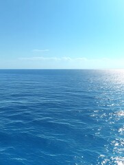 Calm ocean under a clear blue sky.