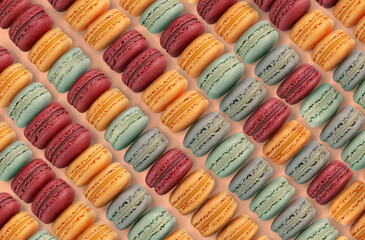 many rows of yellow, red and green macarons