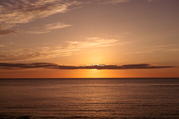 Sunset in the sea in orange tones, Sardinia