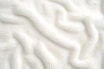 Fototapeta premium White cuddle teddy bear fabric as background, top view