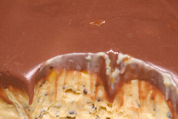 passion fruit mousse with chocolate topping. passion fruit dessert with chocolate. dessert details.