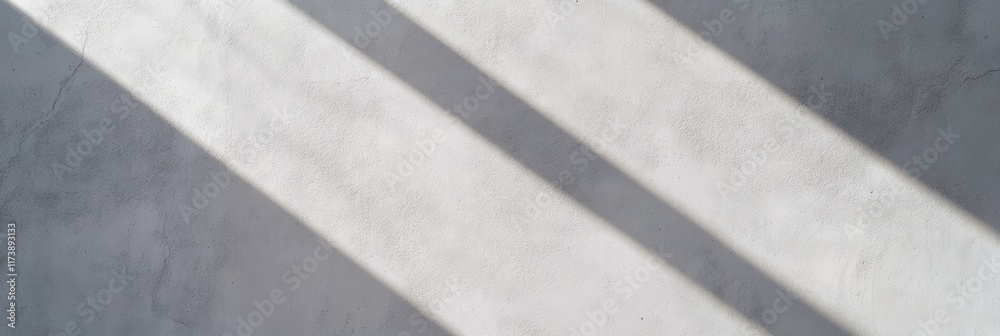 Poster Diagonal window shadows falling on empty concrete wall creating abstract geometric pattern, perfect background for design mockups or presentations