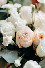 Elegant Arrangement of White and Blush Roses With Green Foliage