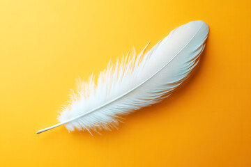 Obraz premium White feather flying on yellow background. Abstract bird feather falling on color background. Symbol of peace or freedom concept. Generated AI