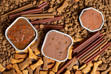 Top view of different types of dog food, dried treats. Dog food concept.