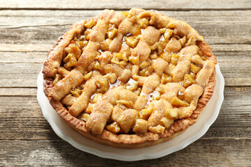 Tasty homemade apple pie on wooden table
