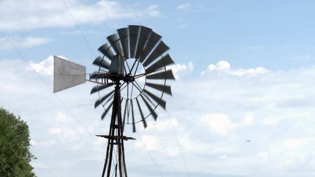 Traditional Windmill Under Blue Sky in Rural Pampas