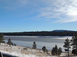 Winter landscape with lake and trees