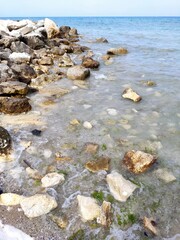 stones by the sea in italy
