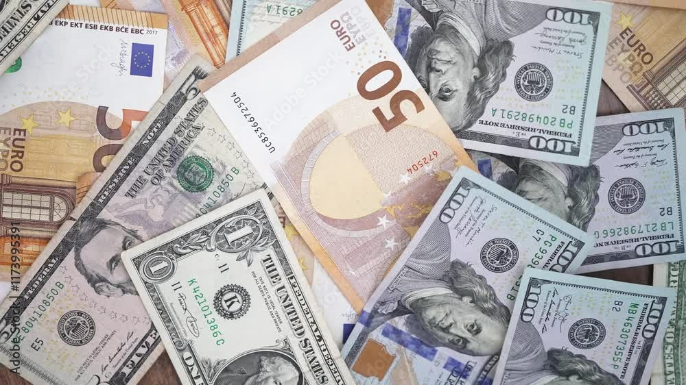 Poster table cluttered with euro and dollar notes captures essence of forex trading with investors speculat