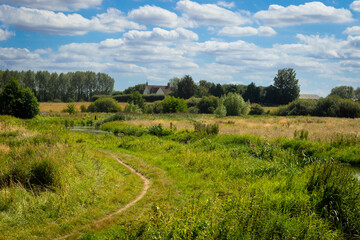 A home barely visible along the river Stort