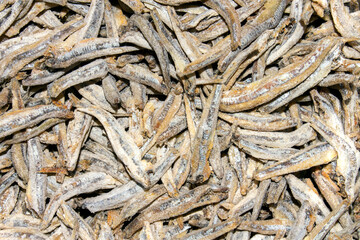 Dried and salted anchovies for beer.Anchovies background.Dried fish.Appetizer for beer.