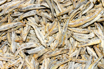 Dried and salted anchovies for beer.Anchovies background.Dried fish.Appetizer for beer.