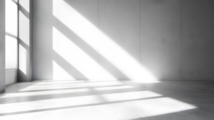 Obraz premium A minimalist, modern interior concept is depicted in , featuring an empty room with a white wall background, ideal for product presentation, with shadows and natural light streaming in