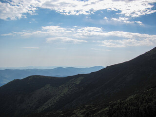 Majestic mountains under a serene sky at midday