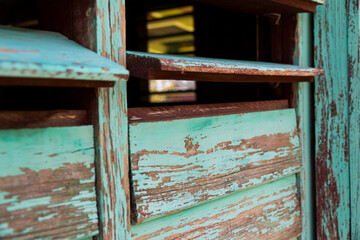Cuba, Havana, green peeling paint on shuttered house windows. 2016-03-27