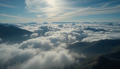 Fototapeta premium Aerial view of majestic mountains piercing through a sea of fluffy white clouds during a breathtaking sunrise, showcasing a serene and inspiring landscape.