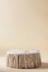 beige sequins pedestal table on a brown background for product presentation