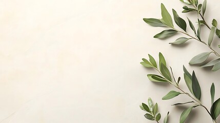 Green leaves arranged on a light beige background