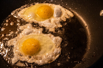 fried eggs in a frying pan