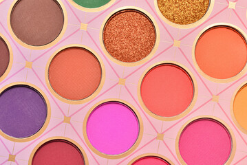 Close up view on bright colors make up palette set. Professional multicolor eyeshadow palette. Professional multicolor eye shadow make-up palette background.