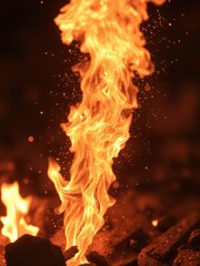 Fototapeta premium Close-up of incandescent fire sparks erupting, glowing embers, campfire, dramatic, ignition