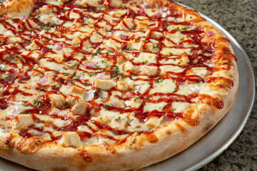 A view of a BBQ chicken pizza.