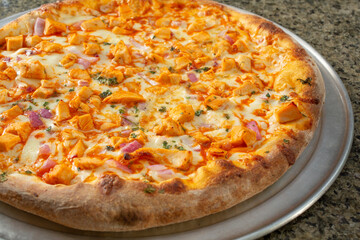 A view of a Buffalo chicken pizza.