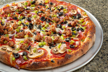 A view of a deluxe pizza.