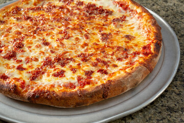 A view of a ground pepperoni pizza.