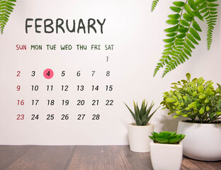 Day 4 of february month, Wooden calendar with date. Empty space for text.