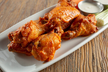 A view of a plate of Buffalo wings.