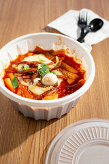 A view of a bowl of tteokbokki soup.