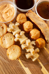 A top down view of assorted oden skewers.