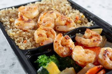 A closeup view of a grilled shrimp bowl.