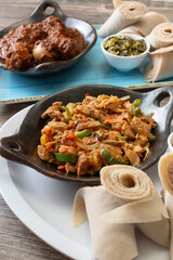 A view of a plate of yedoro tibs, among other Ethiopian entrees.