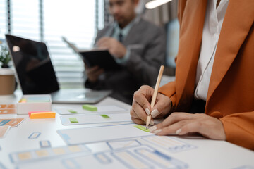 ux developer and ui designer brainstorming about mobile app interface wireframe design in the office, website designer, creative planning phone app development template