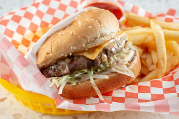 A view of a cheeseburger entree.