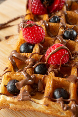 A closeup view of a chocolate hazelnut drizzle waffles.